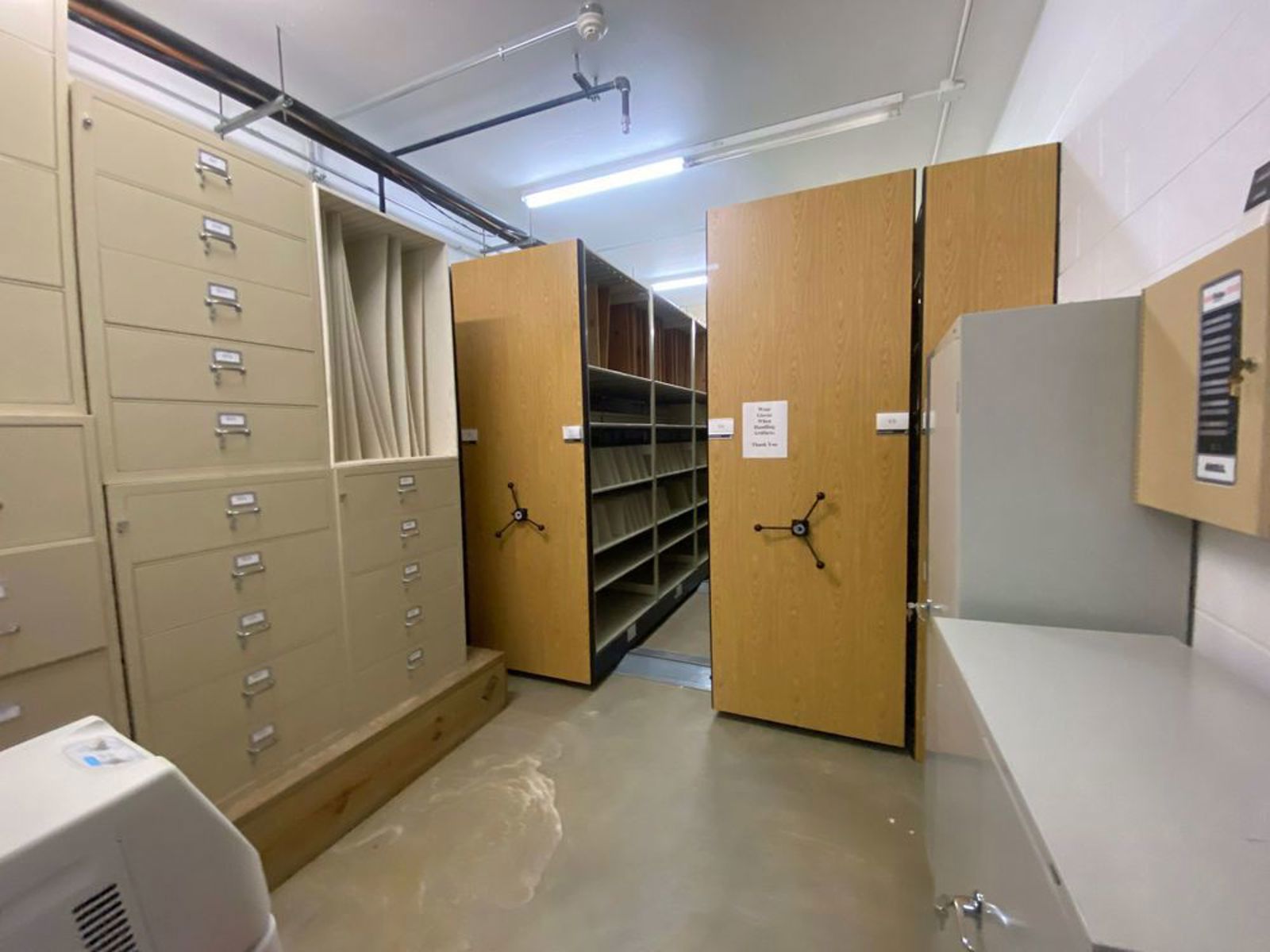 large_8e4cc223-89f8-460b-8cf8-47635031bb5d.basement-archives-1